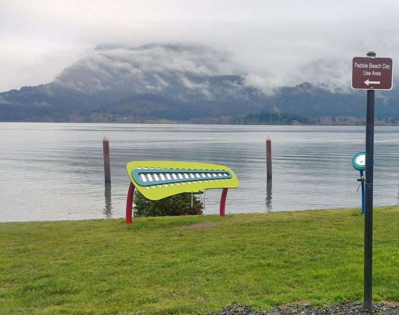 May contain: nature, outdoors, scenery, bench, furniture, water, waterfront, grass, plant, and lake