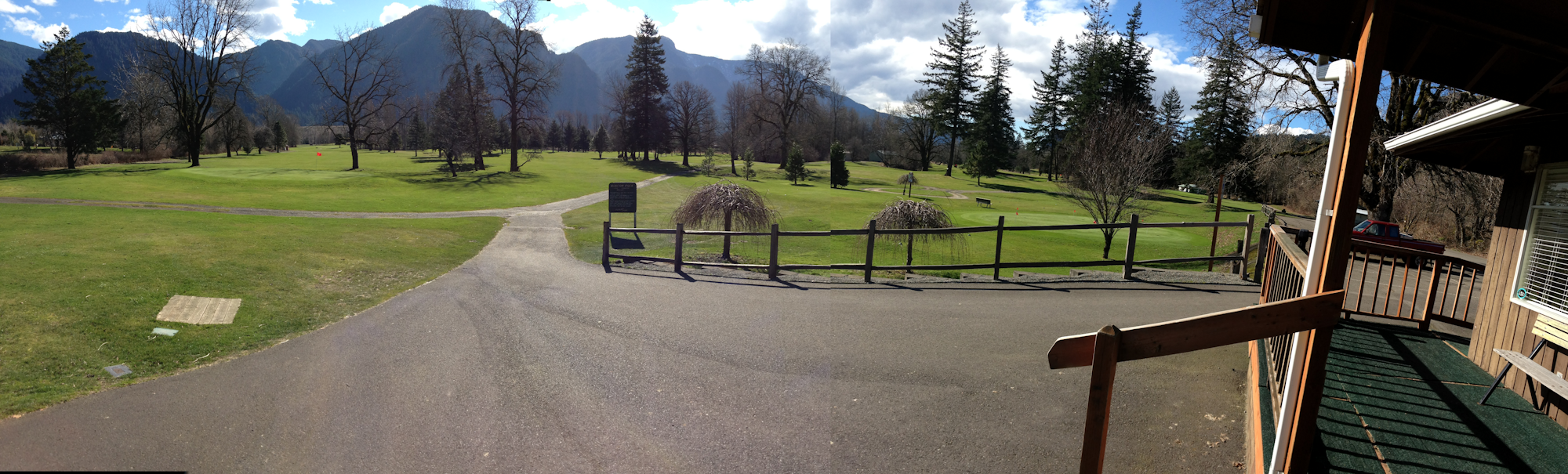 May contain: nature, outdoors, scenery, grass, plant, fir, tree, field, handrail, and park