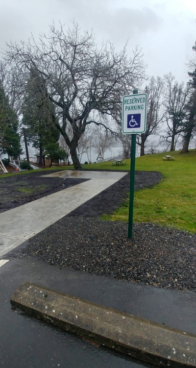 May contain: road, path, tarmac, grass, nature, outdoors, park, plant, sidewalk, tree, city, street, urban, sign, symbol, and vegetation