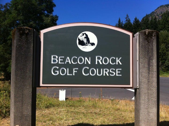 May contain: grass, nature, outdoors, park, plant, vegetation, sign, symbol, land, tree, woodland, and path