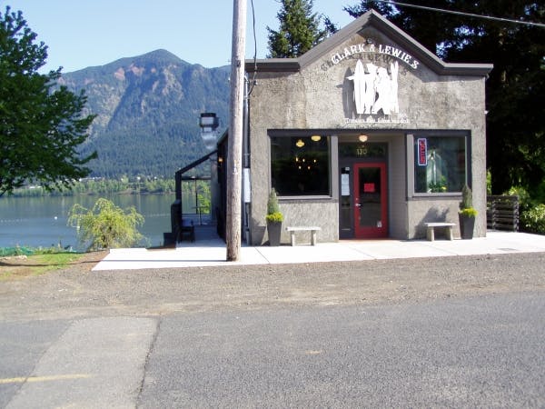 May contain: nature, outdoors, scenery, bench, furniture, plant, architecture, building, shelter, road, city, and tree