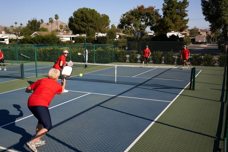 May contain: tennis ball, tennis, sport, ball, person, playing tennis, tennis racket, and racket