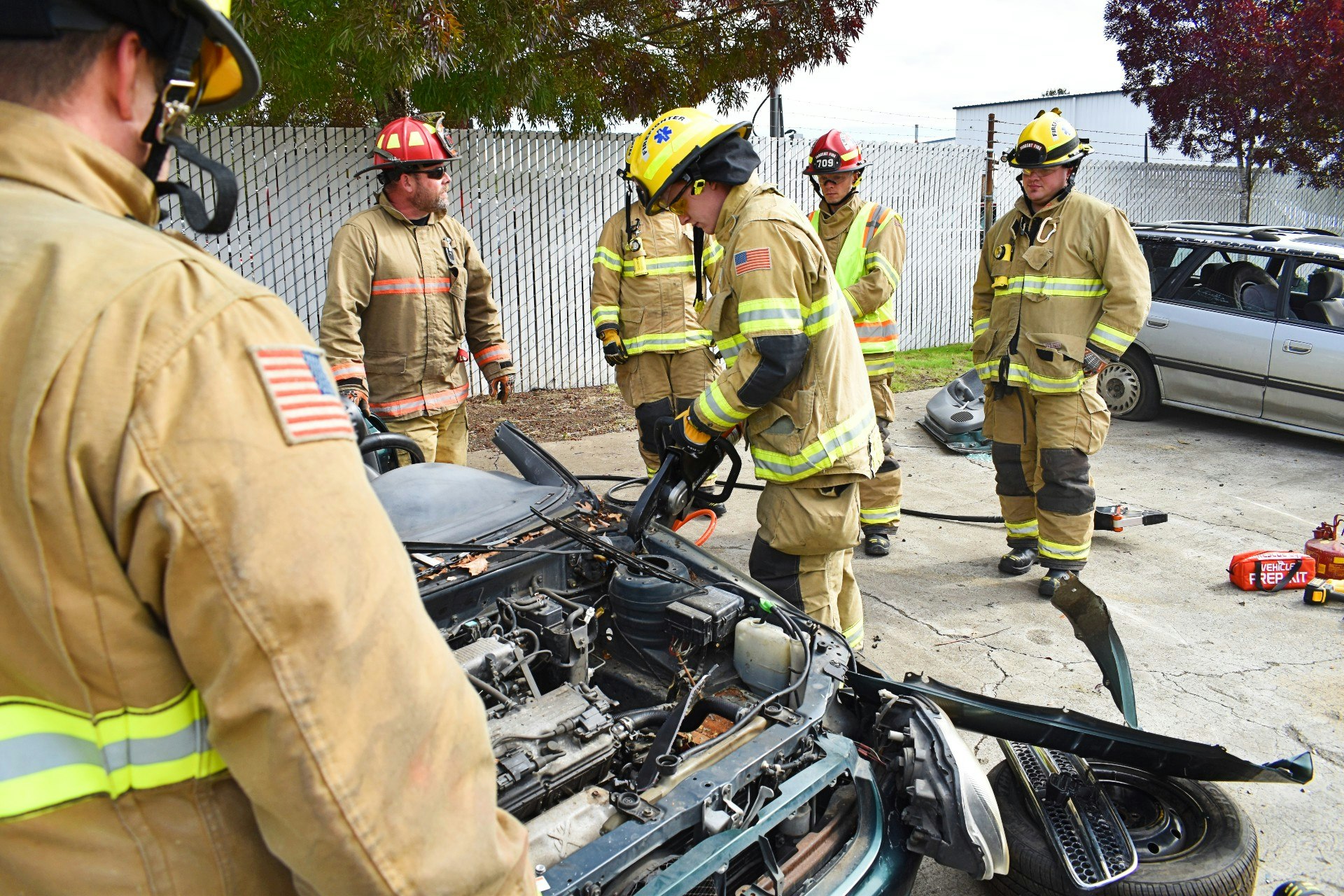 May contain: person, human, fireman, helmet, clothing, apparel, motorcycle, transportation, vehicle, and machine