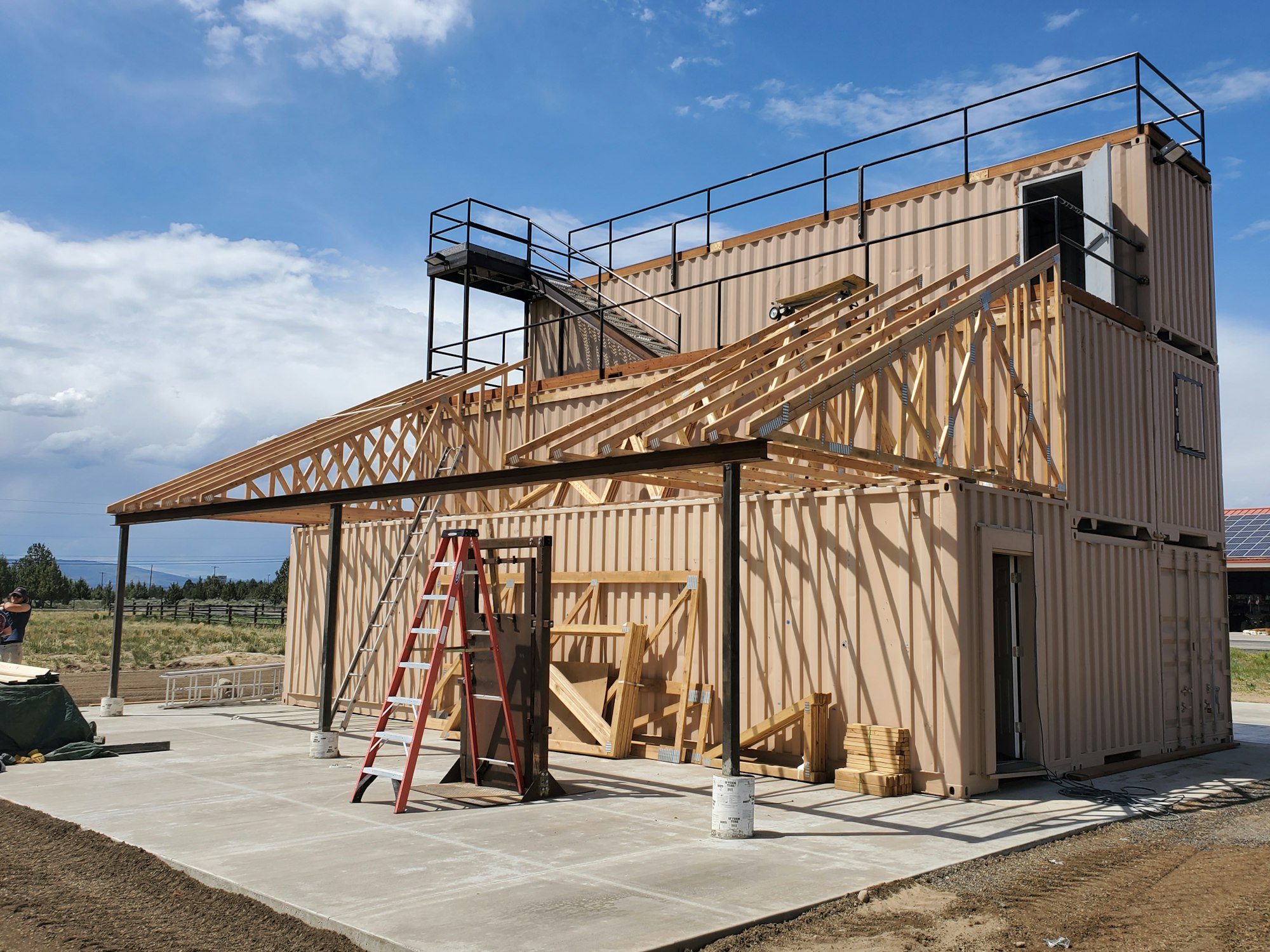 May contain: wood, outdoors, nature, building, and bridge
