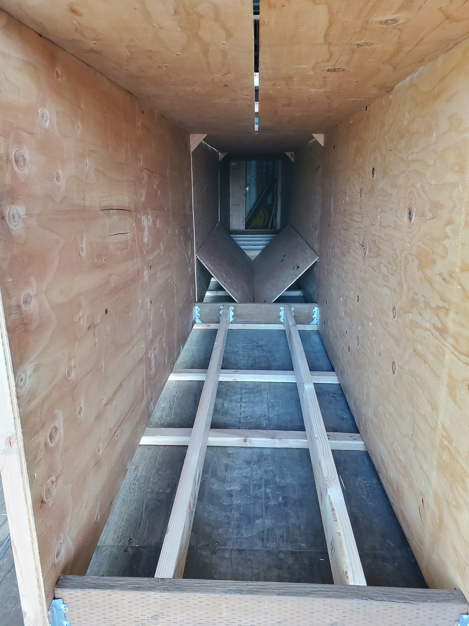 May contain: corridor, bunker, building, handrail, banister, and staircase