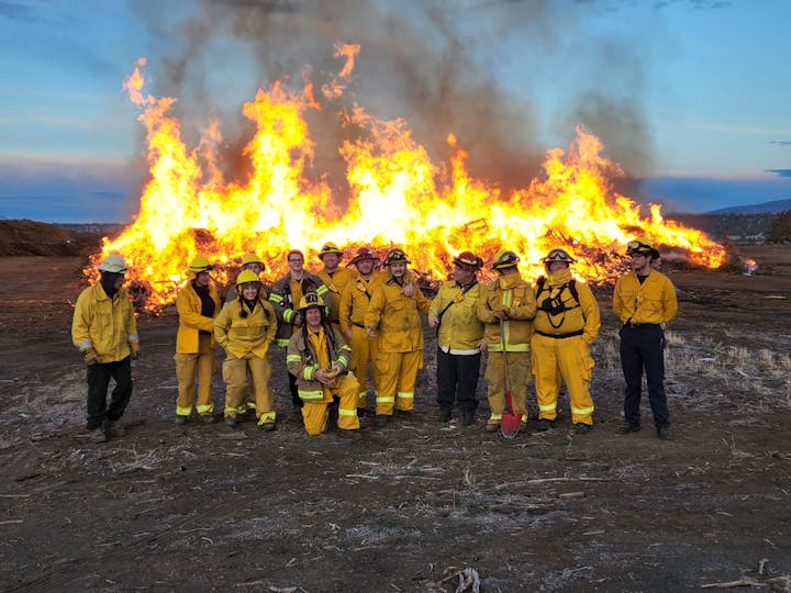 May contain: person, human, fireman, fire, bonfire, and flame