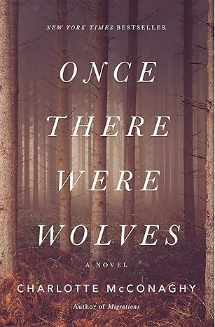 "Once There Were Wolves" book cover by Charlotte McConaghy; forest background.