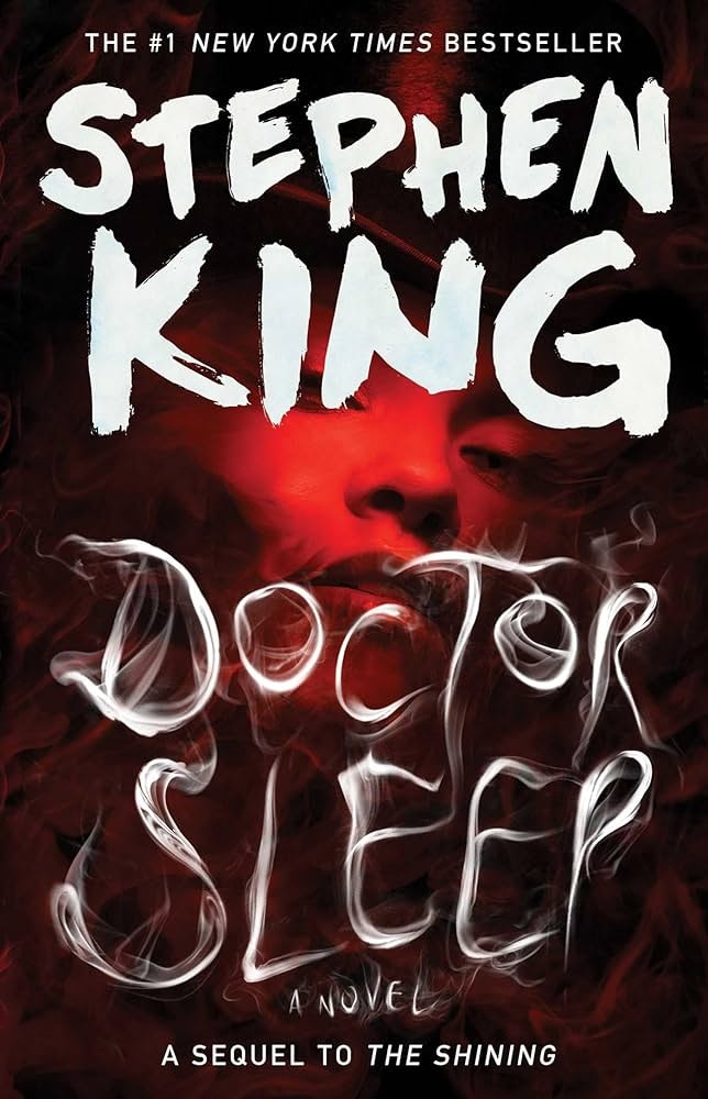 The image features the book cover for "Doctor Sleep" by Stephen King, a sequel to "The Shining." It's visually striking and dark.