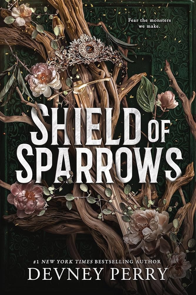 The image features the book cover of "Shield of Sparrows" by Devney Perry, showcasing intricate floral designs and dark, whimsical elements.