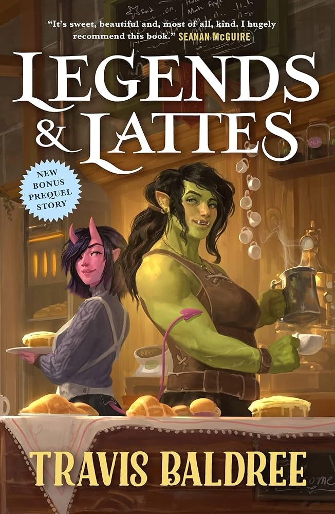 The image features the cover of "Legends & Lattes" by Travis Baldree, showcasing fantasy characters in a warm café setting.