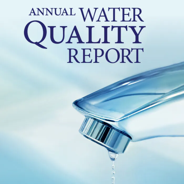 A water faucet with dripping water and text "ANNUAL WATER QUALITY REPORT".