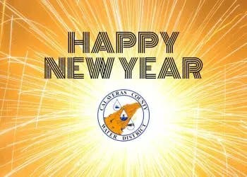 A New Year's greeting with fireworks and a logo in the center.