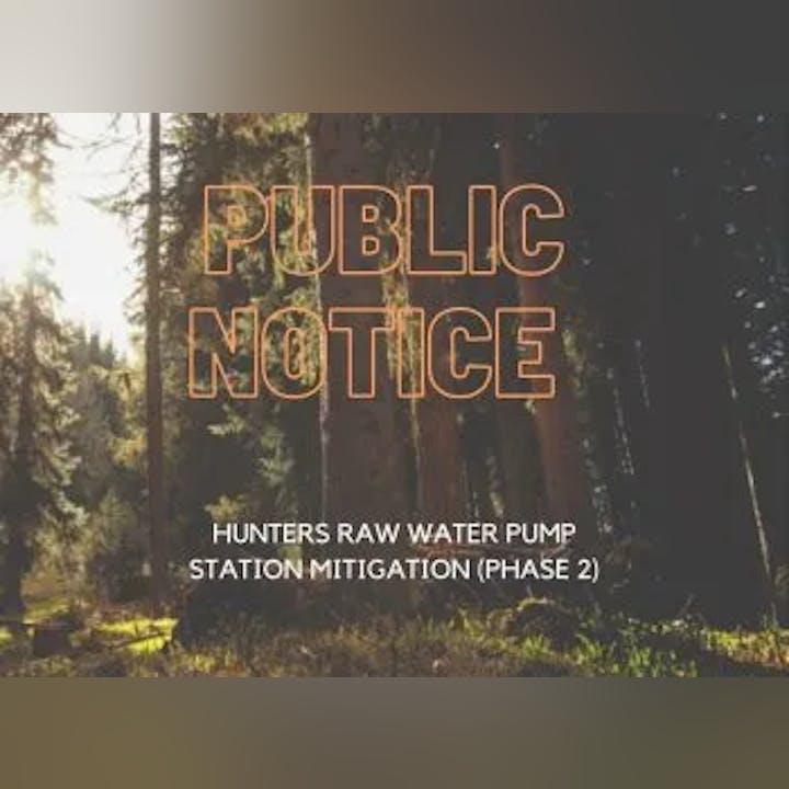 A sign saying "PUBLIC NOTICE - HUNTERS RAW WATER PUMP STATION MITIGATION (PHASE 2)" with a forest background.