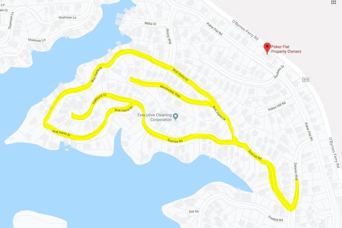 A map featuring streets highlighted in yellow, possibly indicating traffic, with locations like Executive Cleaning Corporation and Poker Flat Property Owners.