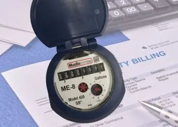A water meter on a utility bill, symbolizing water usage tracking and billing.