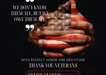 Hands clasped with the US flag design, a tribute to veterans with a quote and notice about office closure.