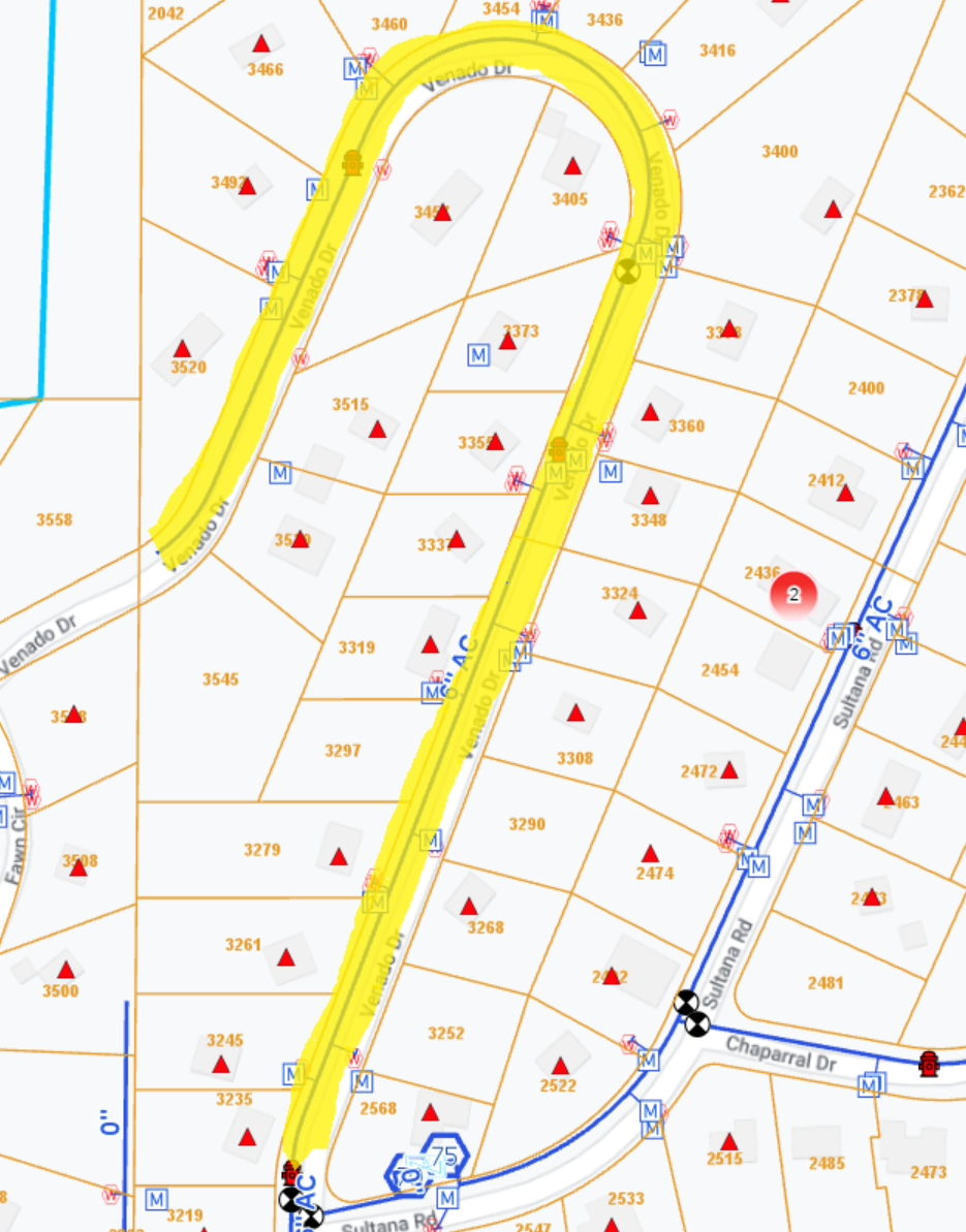 A section of a colorful map with roads, symbols, and numbers, indicating a navigation or utility map.