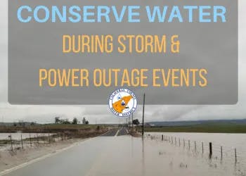 A sign saying "CONSERVE WATER DURING STORM & POWER OUTAGE EVENTS" on a flooded road image.