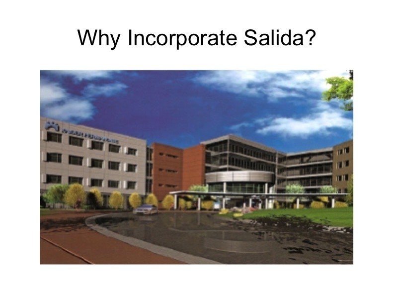 May contain: architecture, building, office building, campus, city, grass, plant, school, condo, housing, urban, car, transportation, vehicle, and hospital