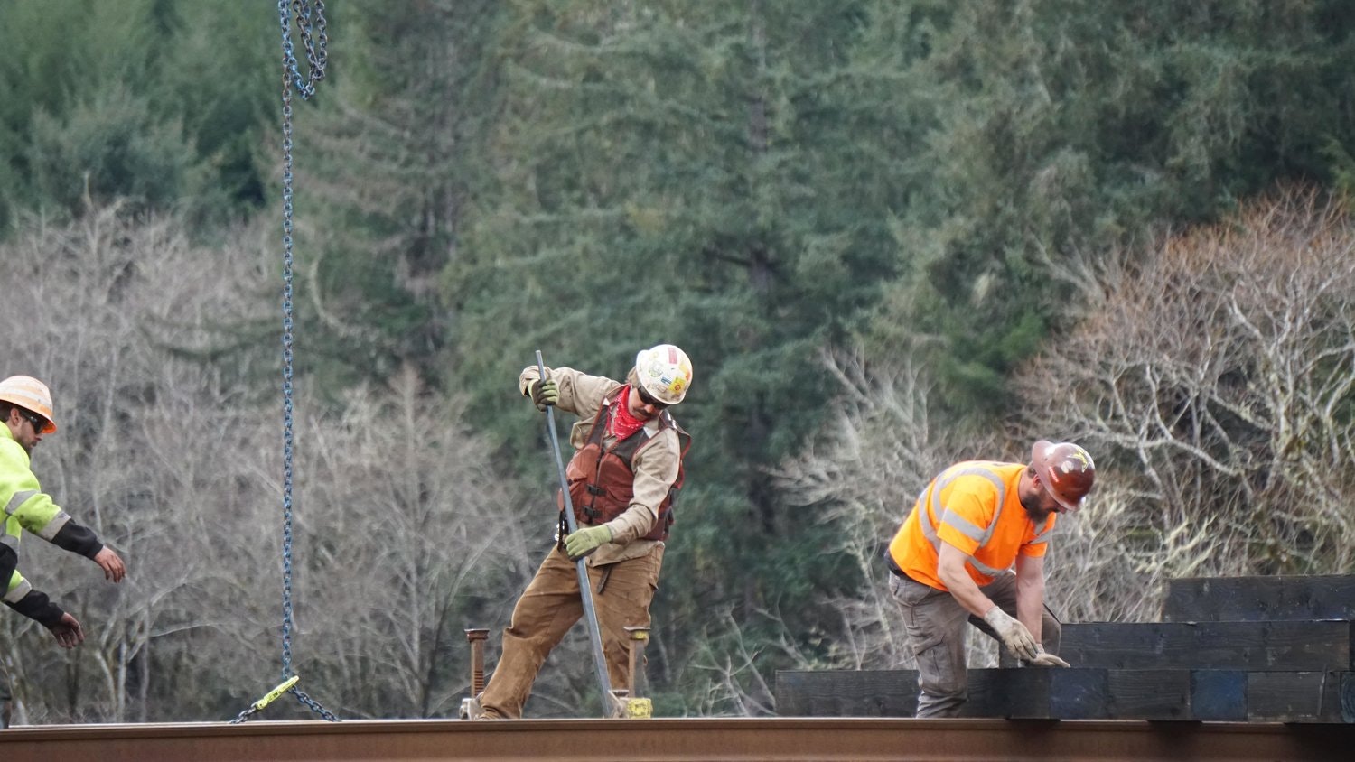 May contain: person, worker, clothing, hardhat, helmet, adult, male, man, sword, weapon, and glove