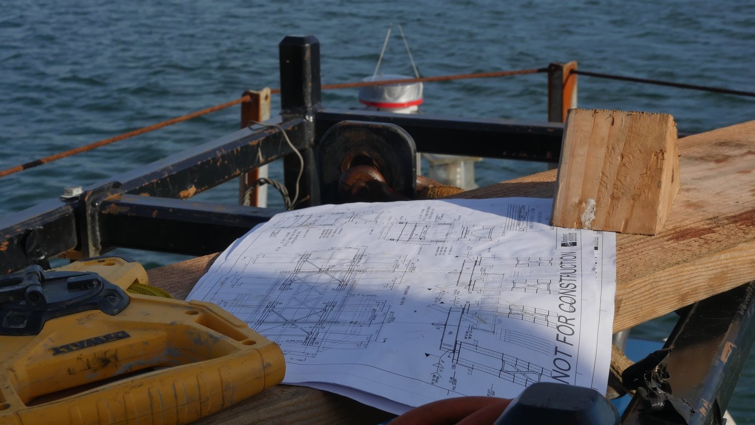May contain: wood, plywood, water, waterfront, transportation, vehicle, watercraft, boat, and sailboat