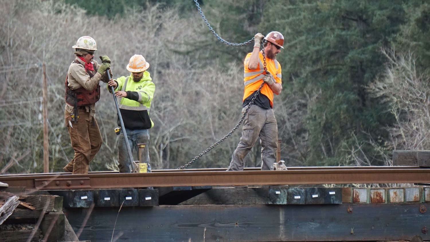 May contain: person, worker, clothing, hardhat, helmet, glove, adult, male, and man