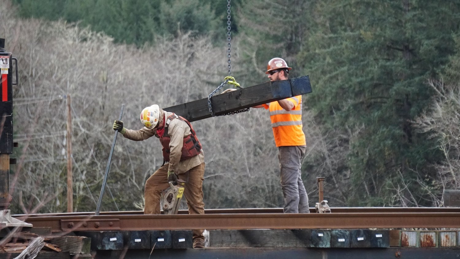 May contain: person, worker, clothing, glove, hardhat, and helmet