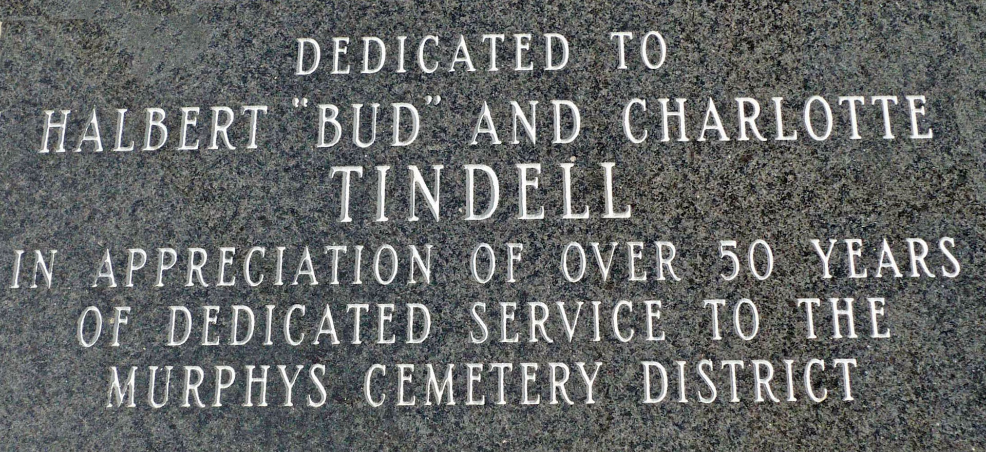 May contain: word and tomb