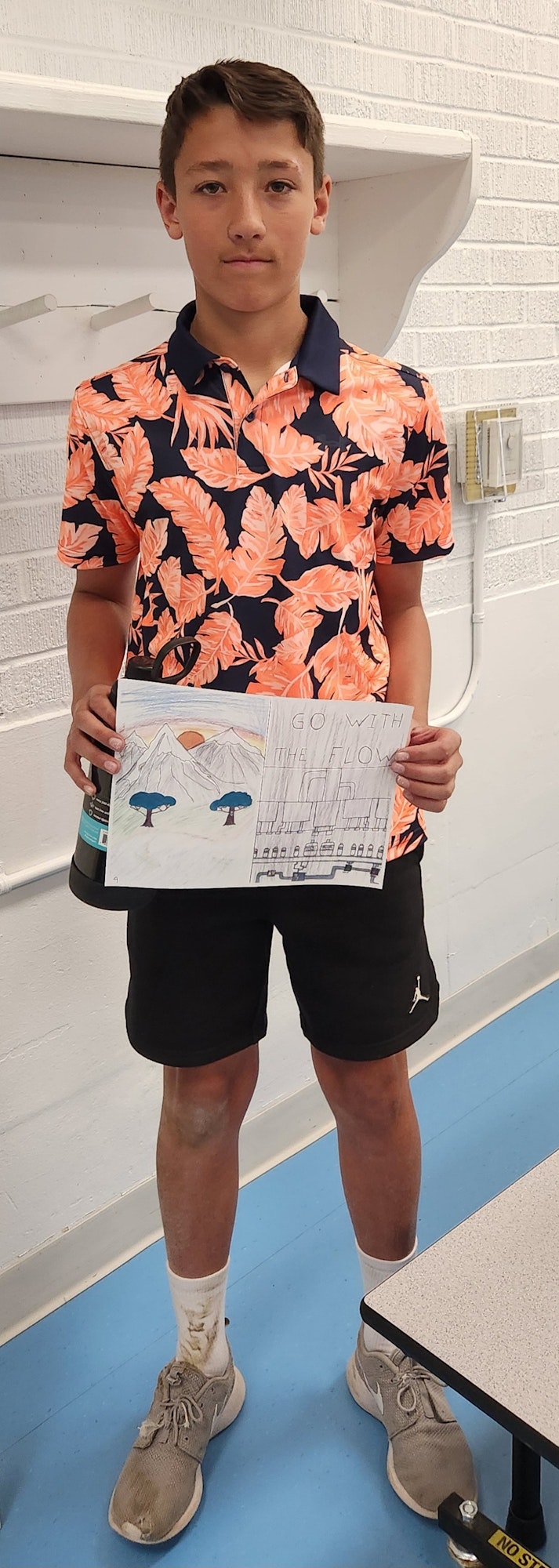 May contain: clothing, shorts, sleeve, footwear, shoe, boy, male, person, teen, beachwear, and sneaker