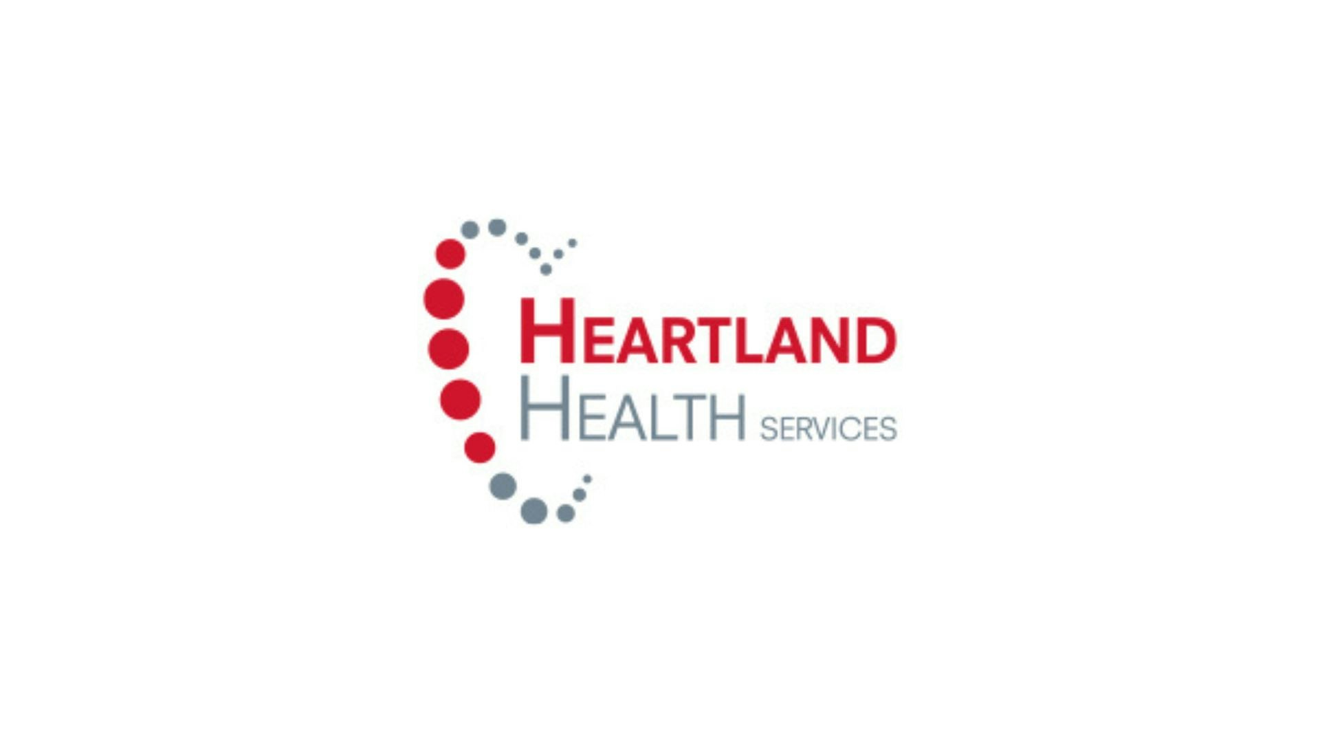 Logo of Heartland Health Services with red and gray dots forming a partial heart shape.