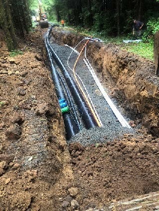 Picture of pipes being installed up to the treatment site for the Beaver Creek Project