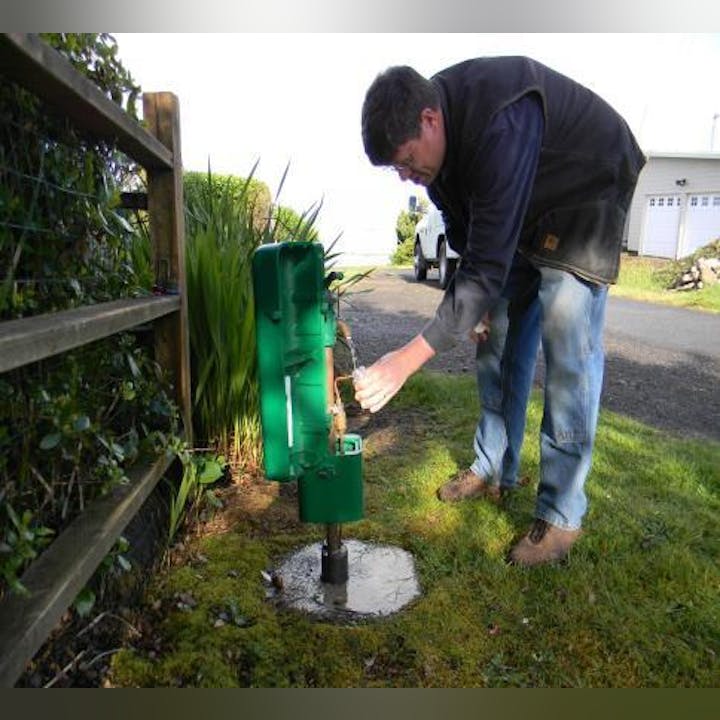 Field employee taking a water sample