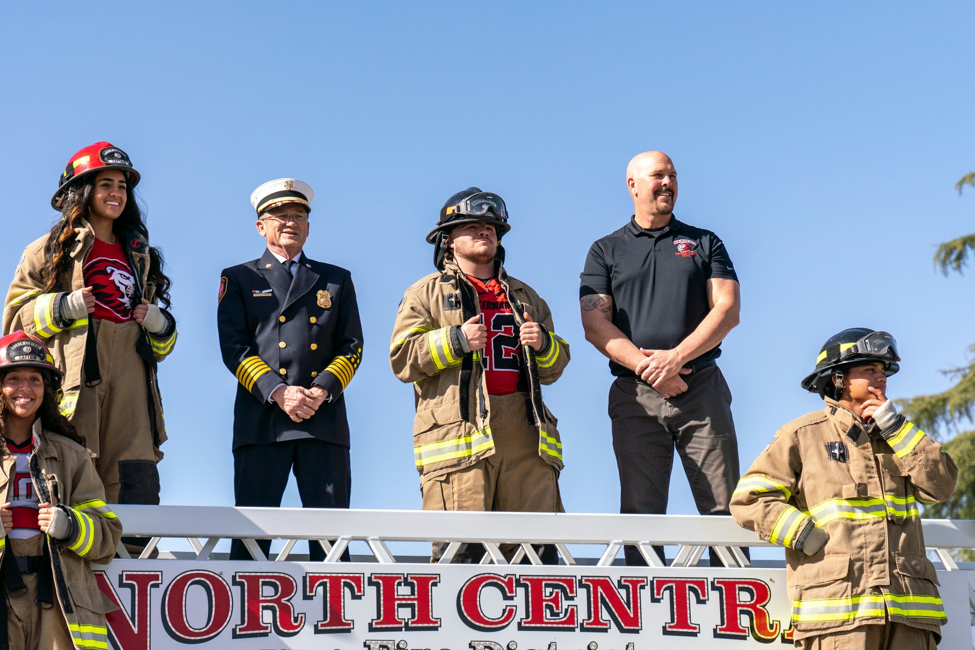 May contain: person, human, helmet, clothing, apparel, fireman, officer, military, and military uniform