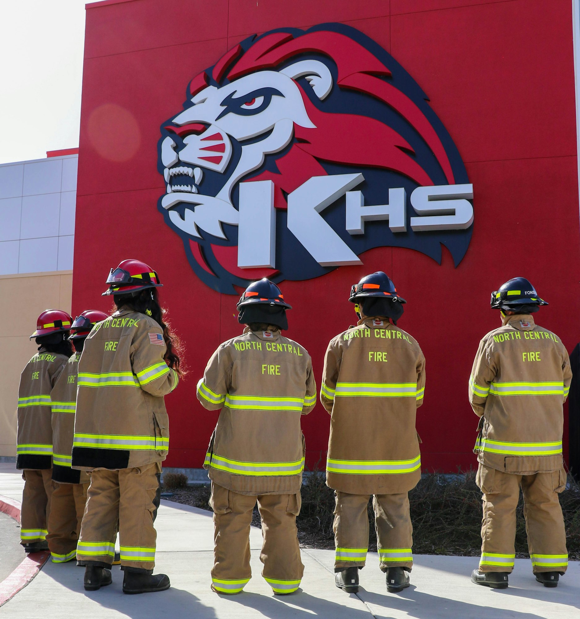 May contain: person, human, fireman, helmet, clothing, and apparel