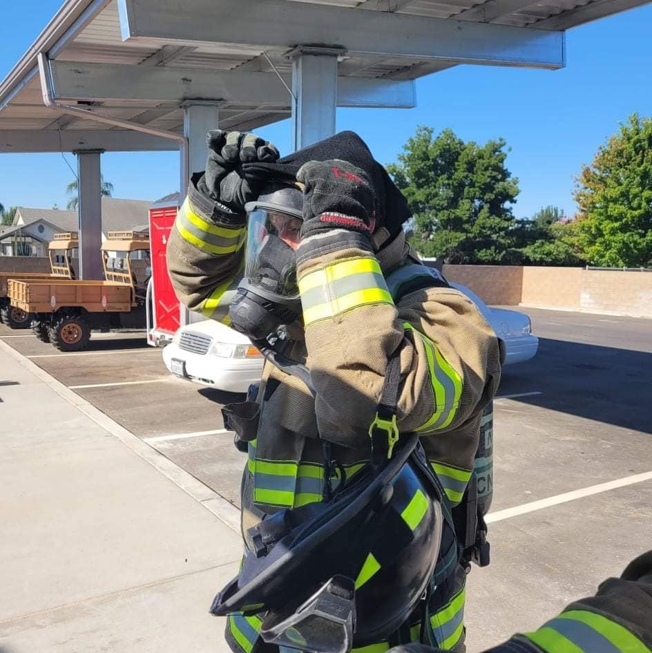 May contain: person, human, truck, transportation, vehicle, and fireman