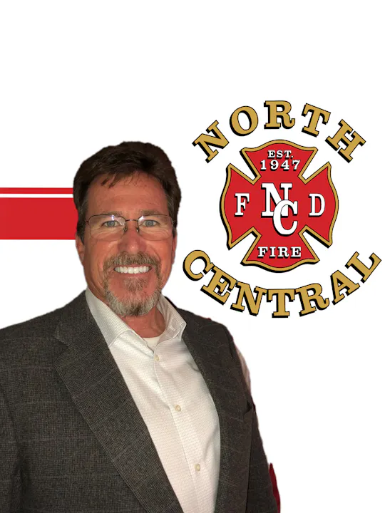 The image features a smiling man in a suit alongside the logo of North Central Fire Department, established in 1947.