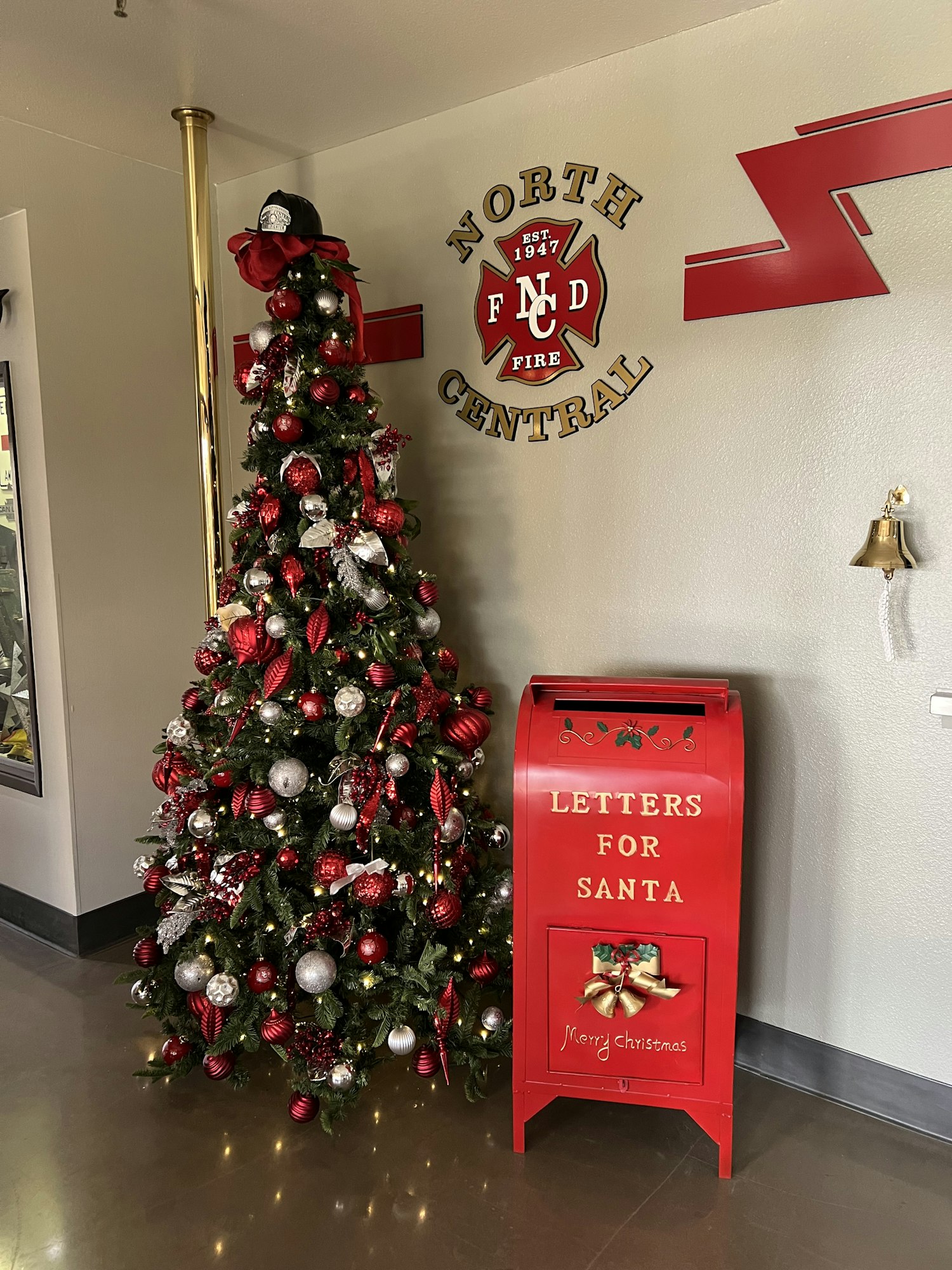 May contain: mailbox, christmas decorations, festival, christmas, and christmas tree