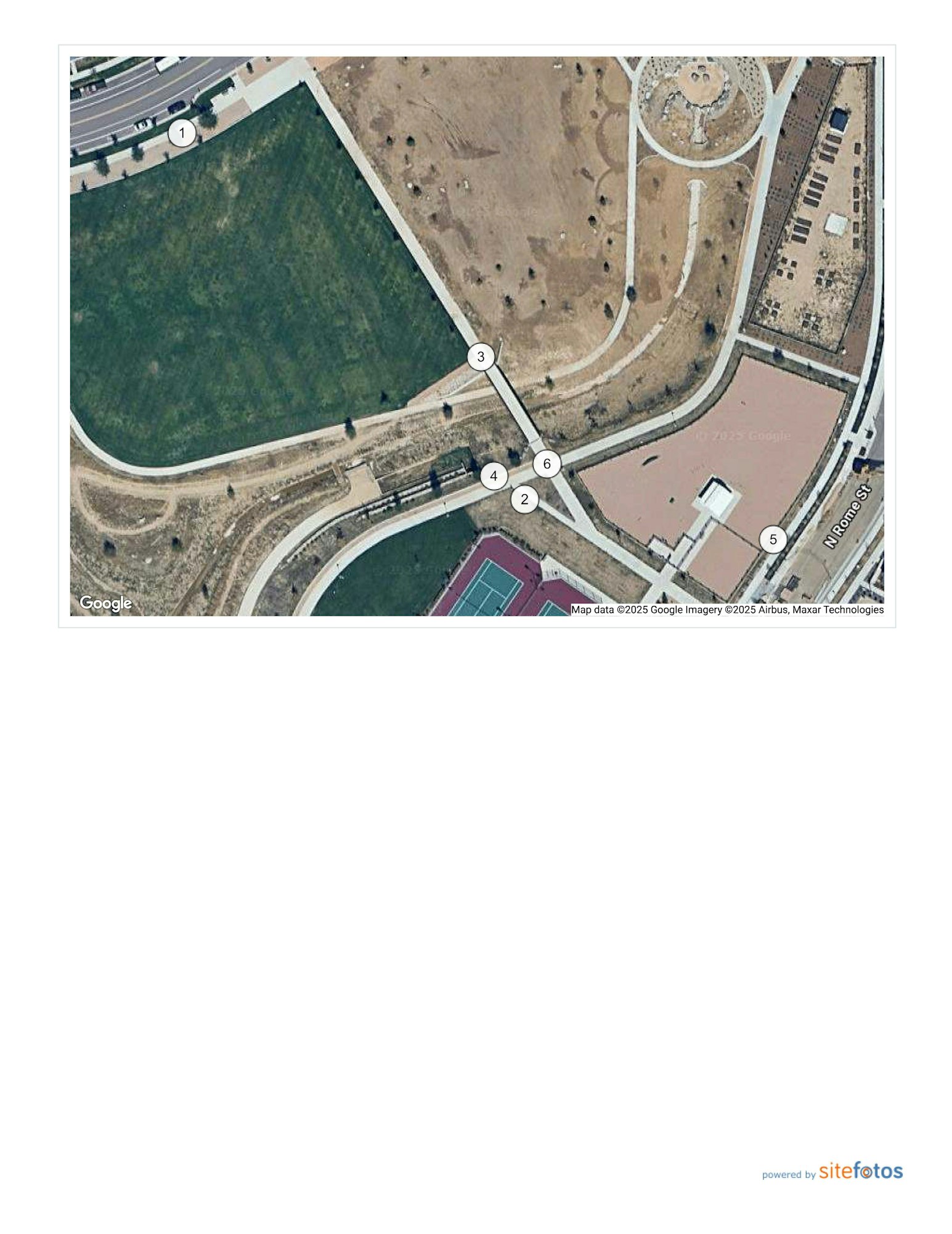 Aerial view of a park with paths, fields, a tennis court, and surrounding roads.