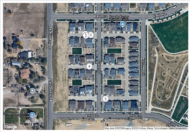 Aerial view of a residential neighborhood with numbered points, houses, streets, and a small park.