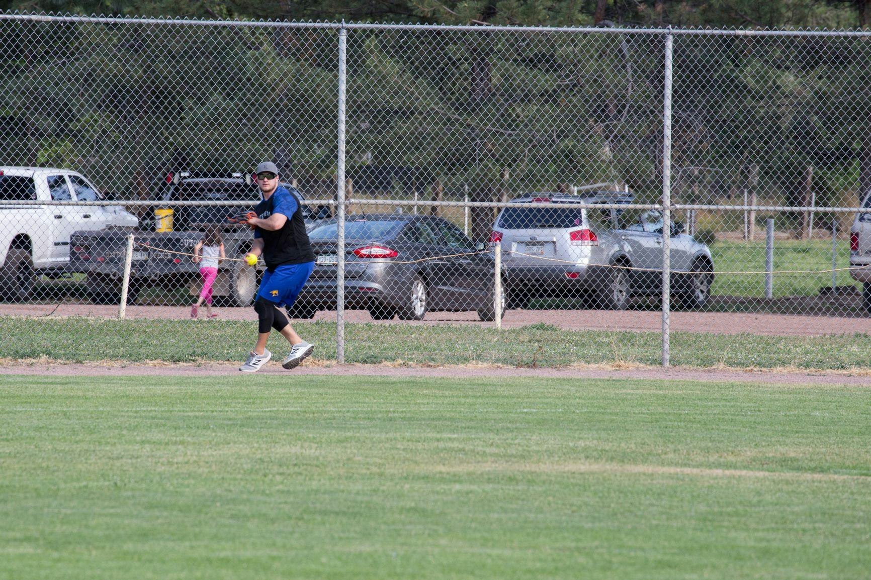 adult softball player in the field