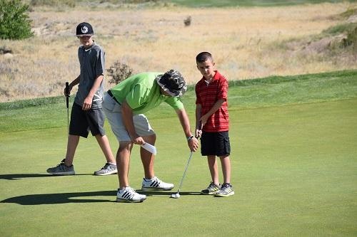 children learning how to play golf