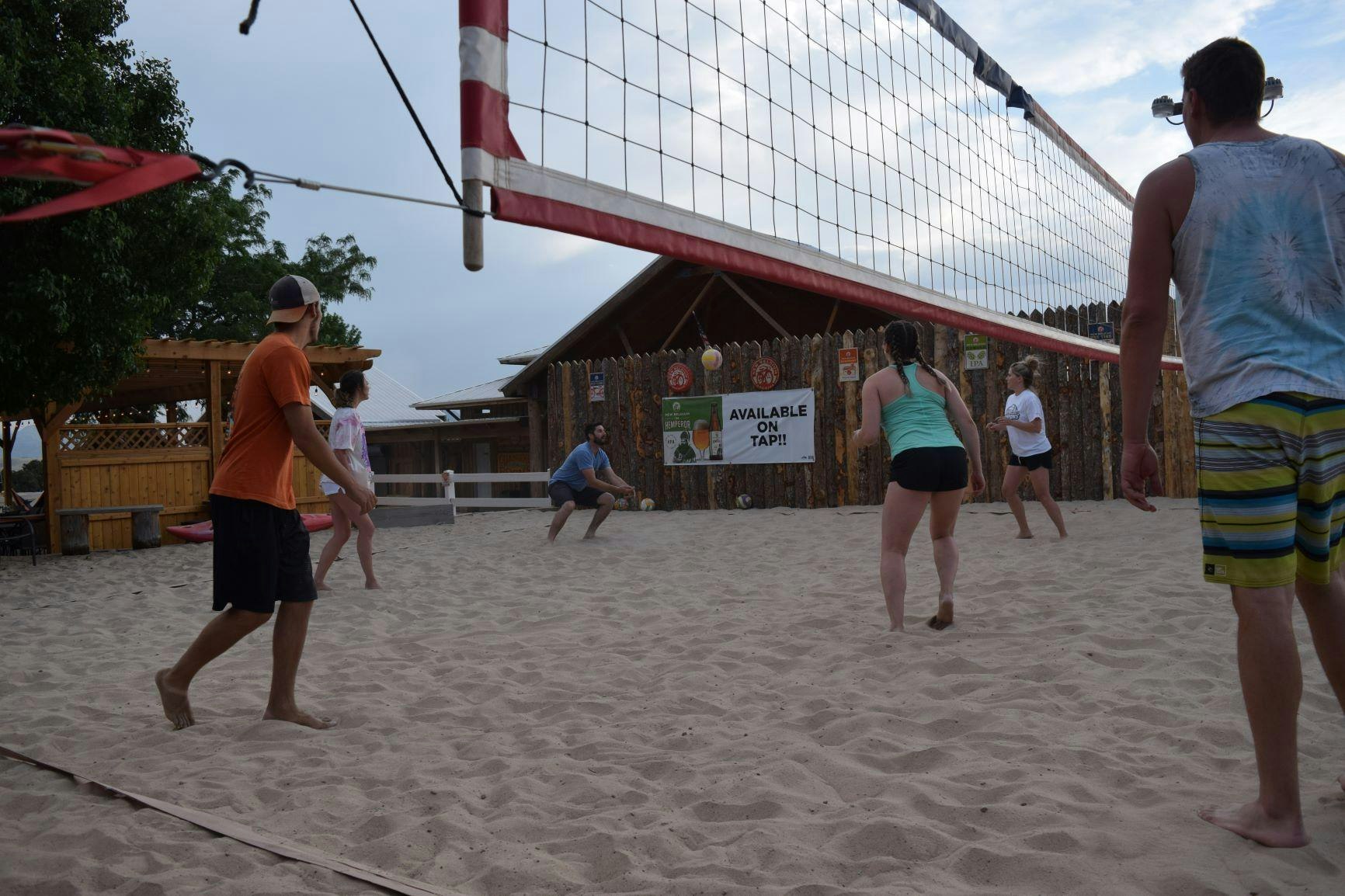 people playing sand volleyball