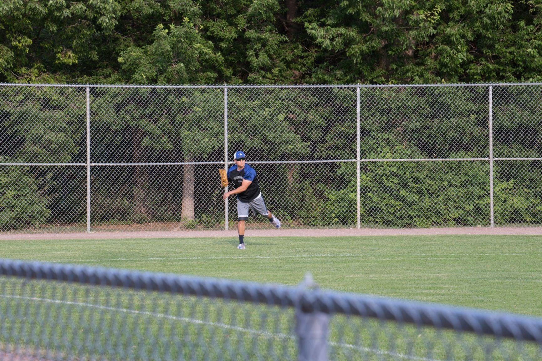 adult softball player in the field