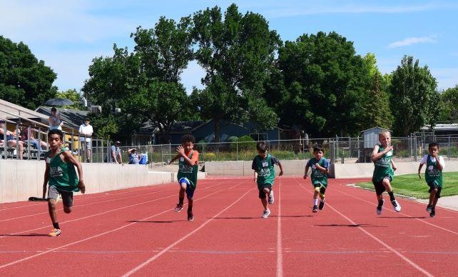 children running at a track and field event