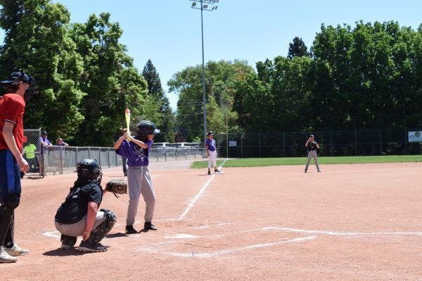 children at bat at a baseball game