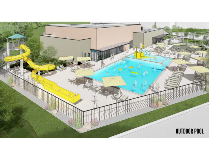 Outdoor pool area with yellow water slides, sun umbrellas, loungers, and people enjoying the space.