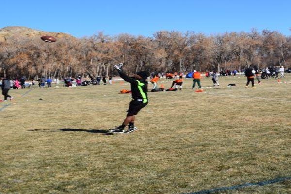 player catching the football at the turkey bowl.