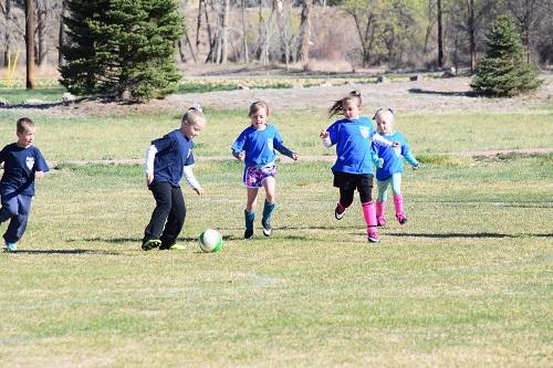 children playing soccer