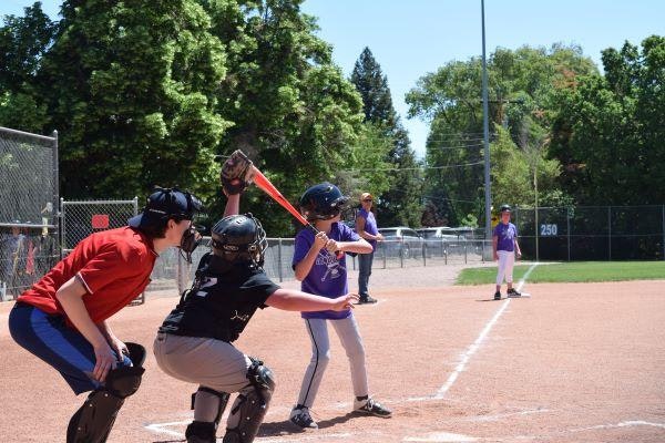 children at bat at a baseball game