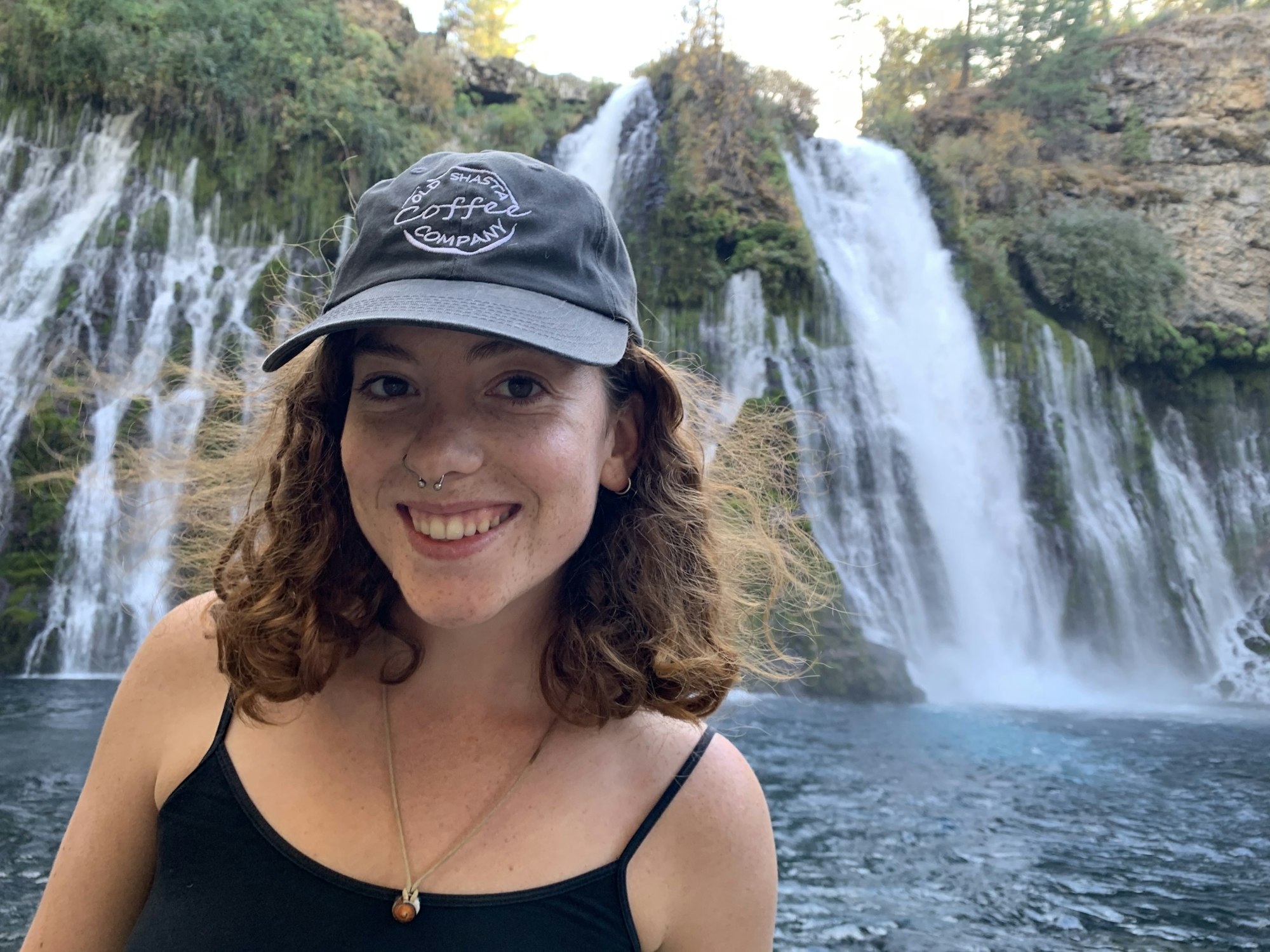May contain: river, water, nature, outdoors, waterfall, person, human, hat, clothing, and apparel